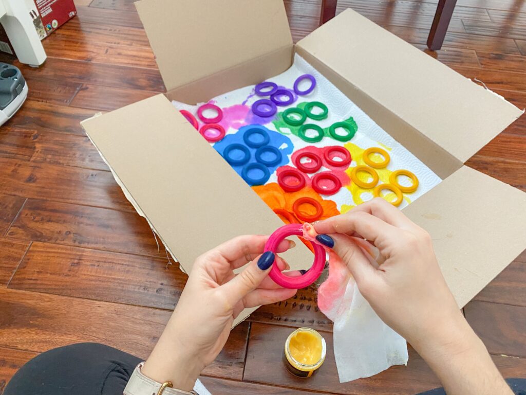 Sealing wooden rings by using a beeswax sealer.
