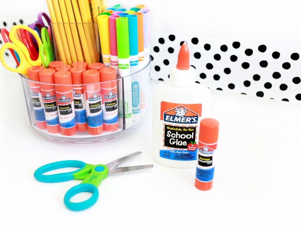 Various school supplies organized in containers