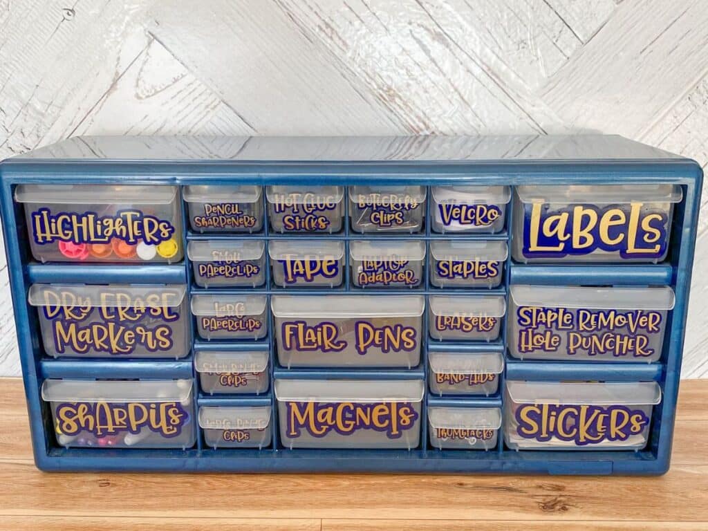 A completed teacher toolbox, made with vinyl labels using a cricut.