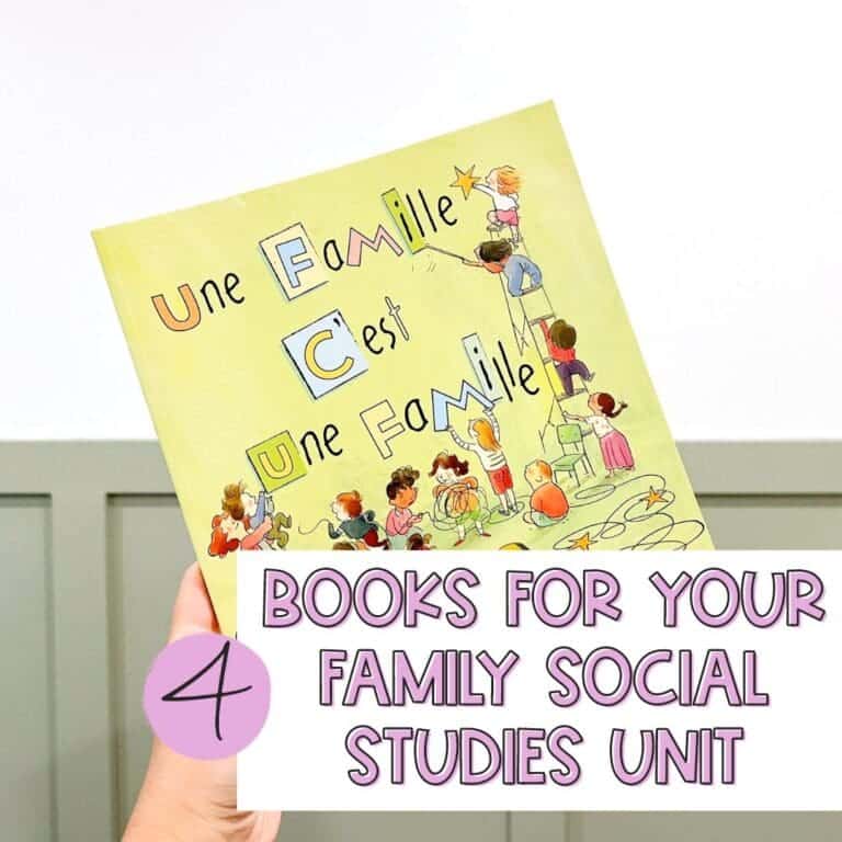 Hand holding French books about families for a social studies unit